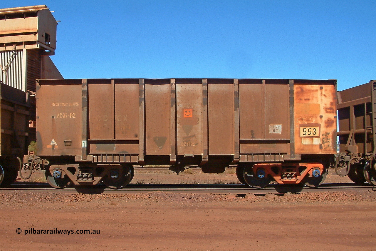 030712 142543
Nelson Point, empty BHP ore waggon 553, one of the original Magor USA build waggons bought out at construction of the Mt Newman project. Visible is the ODCX code and number 82190 from the Oroville Dam Construction company days in the USA. Unsure of the MS6-82 code, the DZ 11-95 code was the late time it was internally painted to reduce wear and the SL 76 with 92 below it was the last time the Miner SL-76 draft gear was replaced. The orange smiley sticker indicates that this is an original 'Oroville Dam' ore waggon and non relayed AB braked. 12th of July 2003.
Keywords: 553;Magor-USA;BHP-ore-waggon