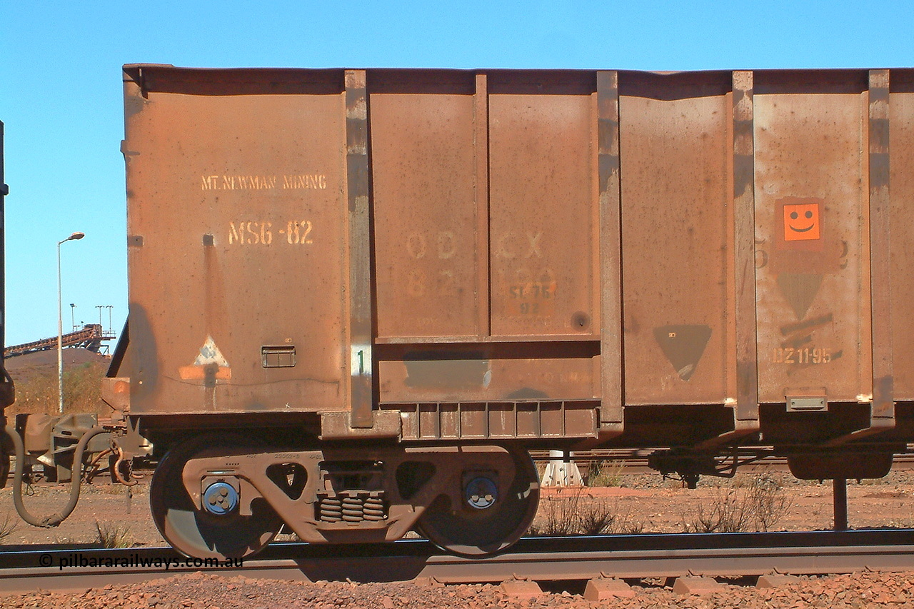 030712 142552
Nelson Point, empty BHP ore waggon 553, one of the original Magor USA build waggons bought out at construction of the Mt Newman project. Visible is the ODCX code and number 82190 from the Oroville Dam Construction company days in the USA. Unsure of the MS6-82 code, the DZ 11-95 code was the late time it was internally painted to reduce wear and the SL 76 with 92 below it was the last time the Miner SL-76 draft gear was replaced. The orange smiley sticker indicates that this is an original 'Oroville Dam' ore waggon and non relayed AB braked. 12th of July 2003.
Keywords: 553;Magor-USA;BHP-ore-waggon