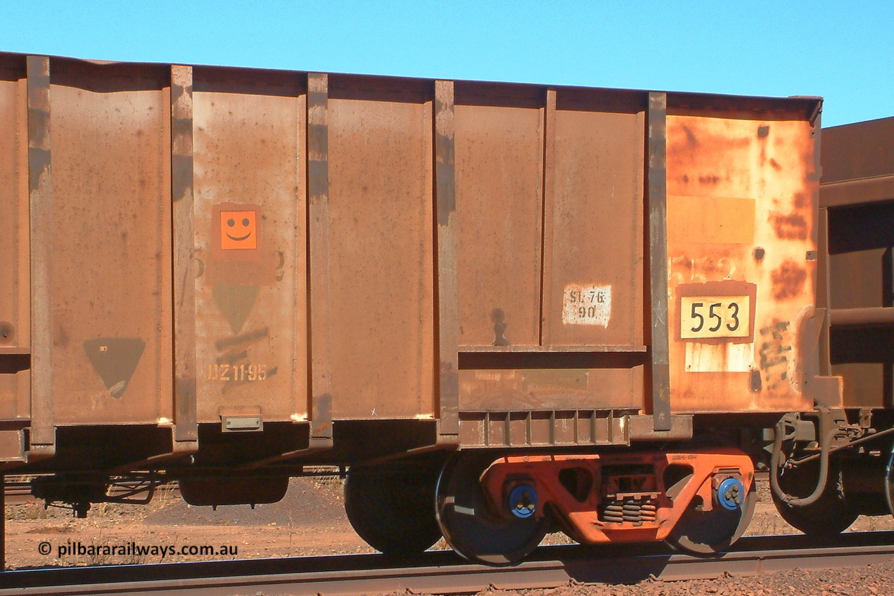 030712 142557
Nelson Point, empty BHP ore waggon 553, one of the original Magor USA build waggons bought out at construction of the Mt Newman project. Visible is the ODCX code and number 82190 from the Oroville Dam Construction company days in the USA. The DZ 11-95 code was the late time it was internally painted to reduce wear and the SL 76 with 90 below it was the last time the Miner SL-76 draft gear was replaced. The orange smiley sticker indicates that this is an original 'Oroville Dam' ore waggon and non relayed AB braked. 12th of July 2003.
Keywords: 553;Magor-USA;BHP-ore-waggon