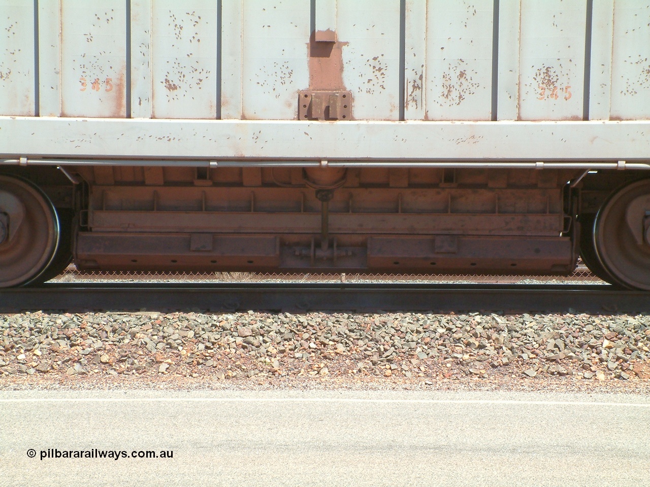 040409 122950
Boodarie, Goldsworthy service bottom discharge Portec USA built ore waggon 345 is one of ten that was purchased second hand in 1992 from Phelps Dodge Copper Mine, believed to be built in 1980s. View of discharge door. 9th April 2004.
Keywords: 345;Portec-USA;BHP-ore-waggon;