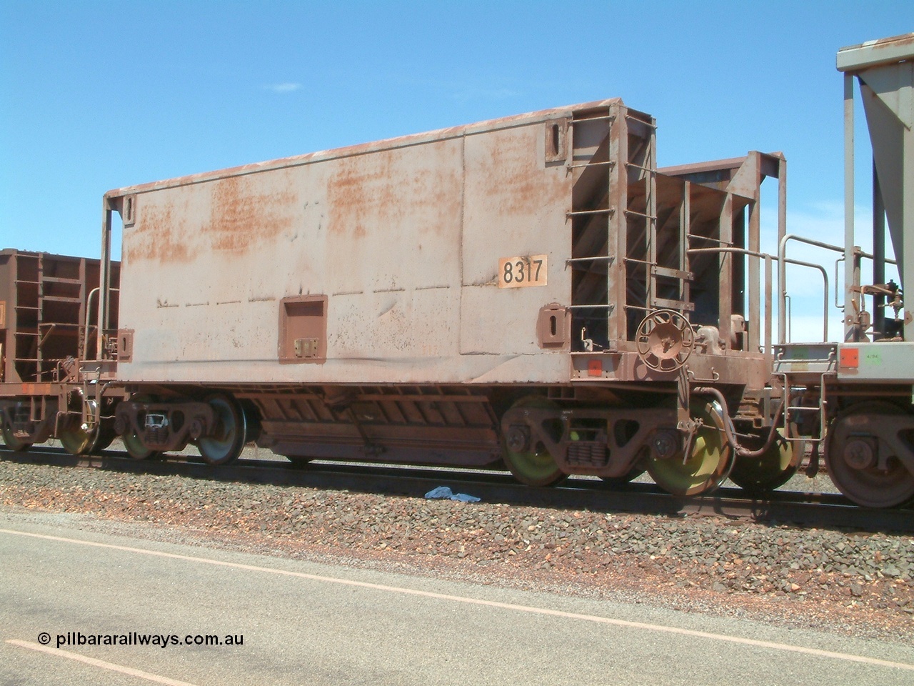 040409 123108
Boodarie, Goldsworthy service bottom discharge Gunderson USA built ore waggon 8317 is one of forty five that was purchased second hand in 1992 from Phelps Dodge Copper Mine, believed to be built in 1970s. 9th April 2004.
Keywords: 8317;Gunderson-USA;BHP-ore-waggon;