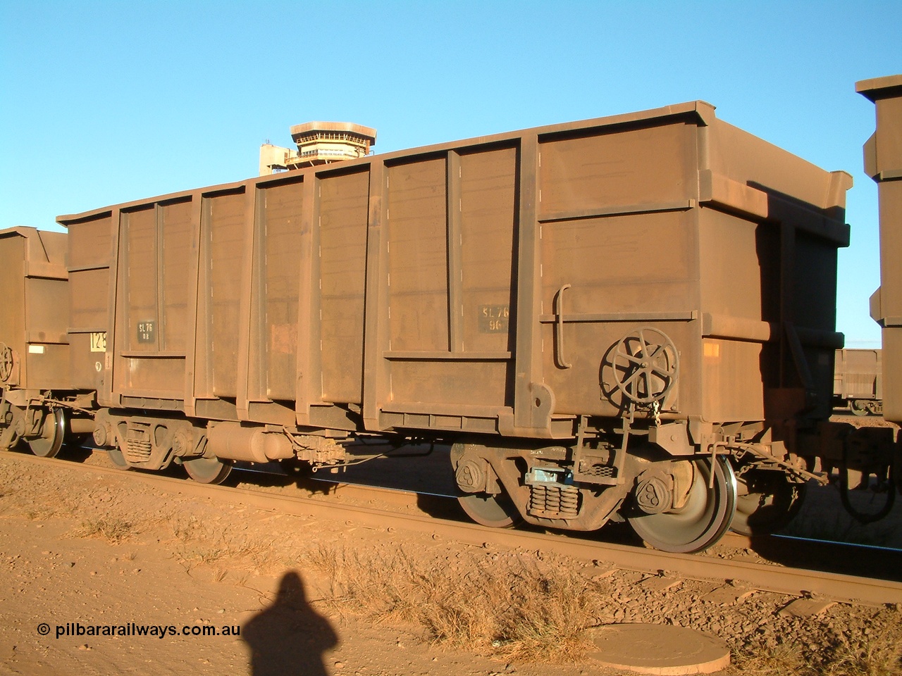 040815 165746
Nelson Point Car Dumper 2, a waggon originally built by Comeng WA in 1973-74 and numbered 1283. But note the rounded bottom edge, this shows that it is a rebuilt ore waggon with 3CR12 stainless steel sides, while the ends, transoms and side ribs are the originals. These waggons were originally of a plain steel construction and were painted inside to prevent rust and wear. 15th August 2004.
Keywords: 1283;Comeng-WA;BHP-ore-waggon;