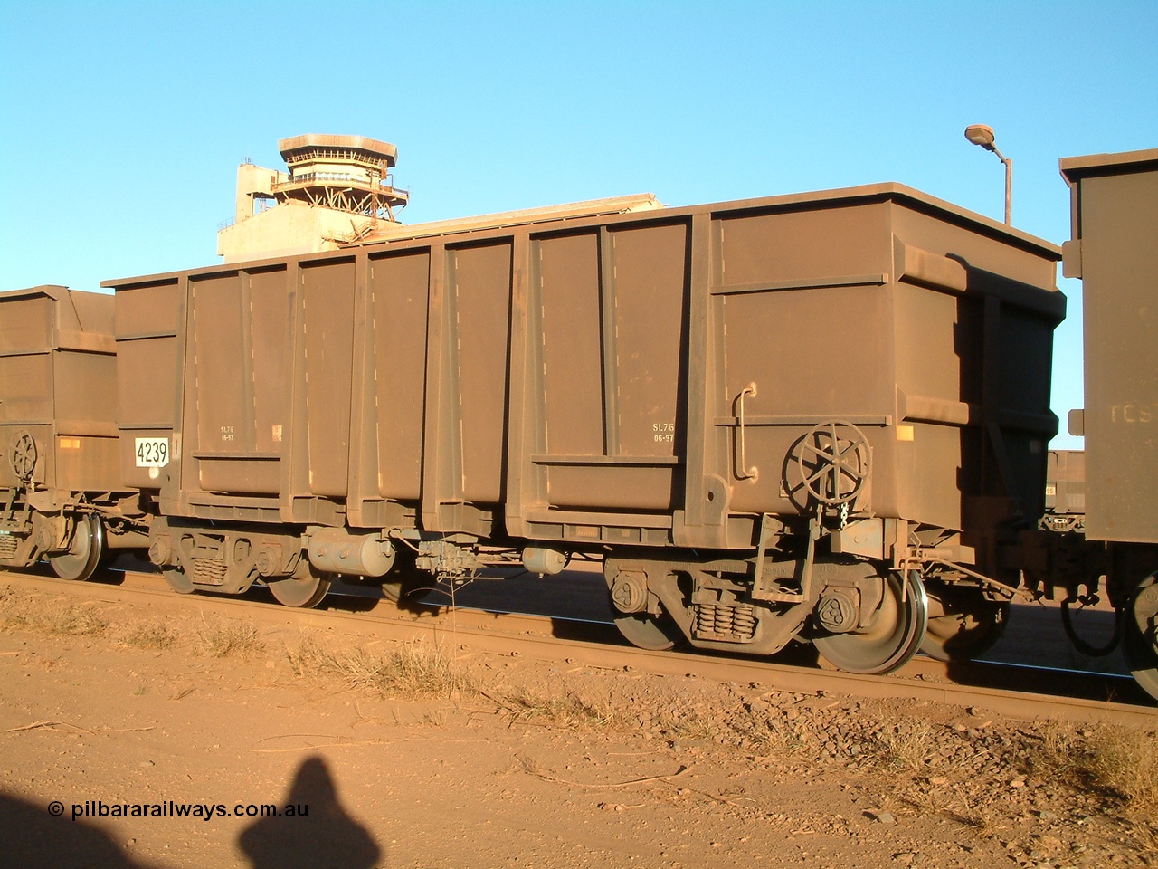 040815 165832
Nelson Point Car Dumper 3, a new Goninan built ore waggon 4239, one of 126 such waggons constructed during 1997 out of 3CR12 stainless steel in an effort to eliminate painting and to reduce wear on the waggon body. Note the rounded bottom edge and tapered floor, this design was designated HC7081. 15th August 2004.
Keywords: 4239;Goninan-WA;BHP-ore-waggon;