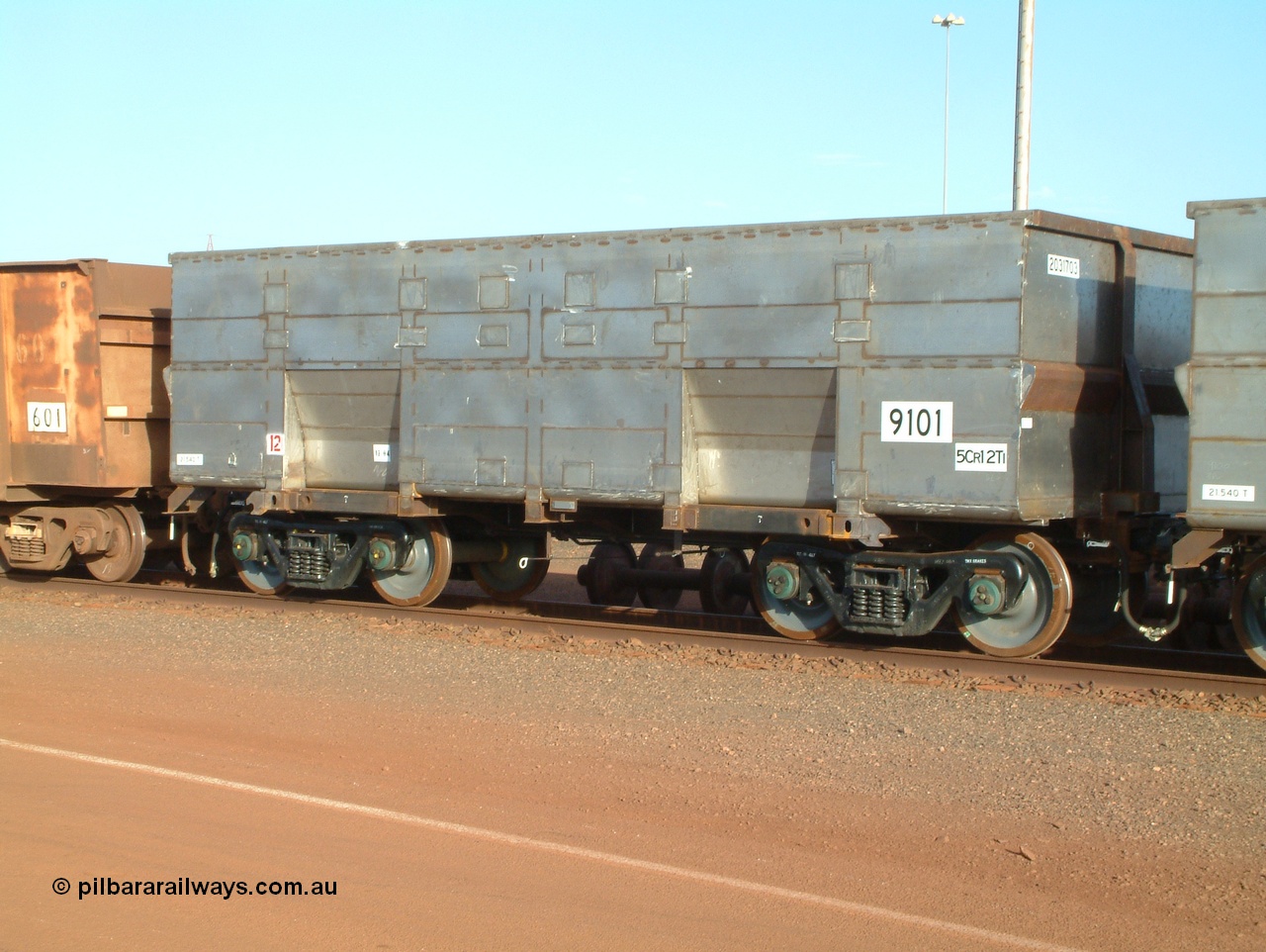 041225 064634
Nelson Point Ore Car Repair Shops, brand new Bradken NSW built ore waggon 9101 asset number 2031703. These waggons are the latest additions to the fleet with 20 on order in total. They are made from the same 5Cr12Ti steel that the Goninan Golynx waggons are made. 25th December 2004.
Keywords: 9101;Bradken-NSW;BHP-ore-waggon;