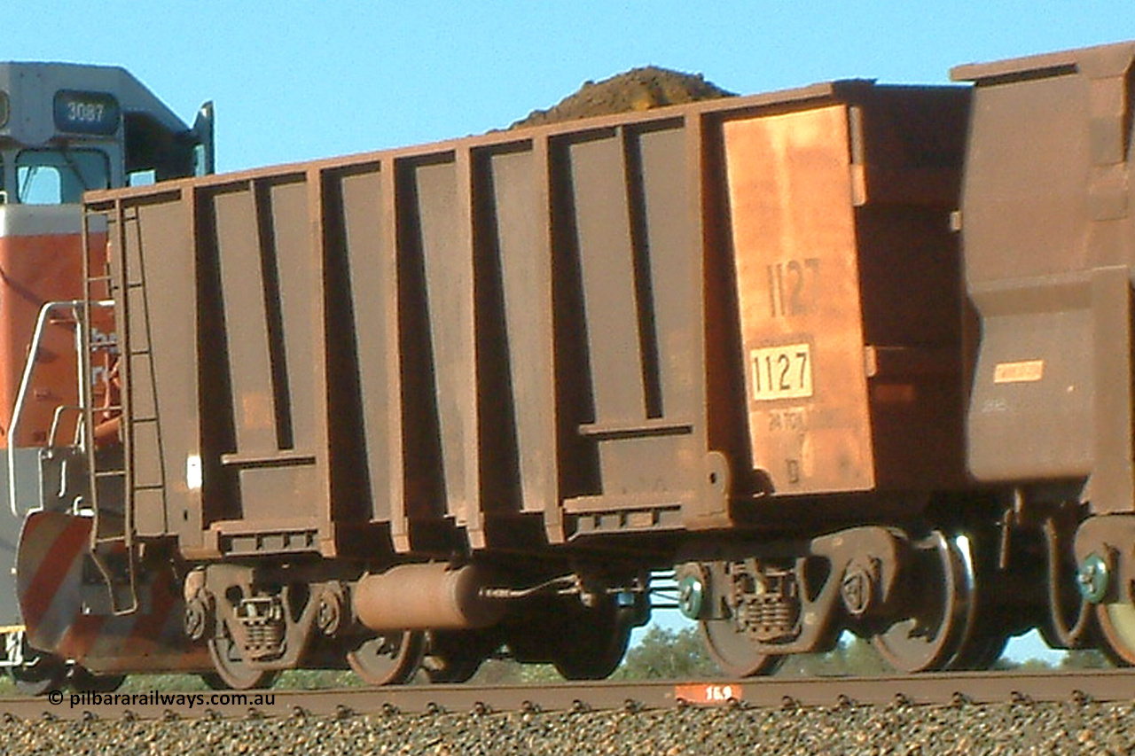 1127 Comeng 040802 155612
Bing, loaded BHP ore waggon 1127, one of a Comeng WA 1971 build of one hundred and eighty-three waggons. August 2, 2004.
Keywords: 1127;Comeng-WA;BHP-ore-waggon;