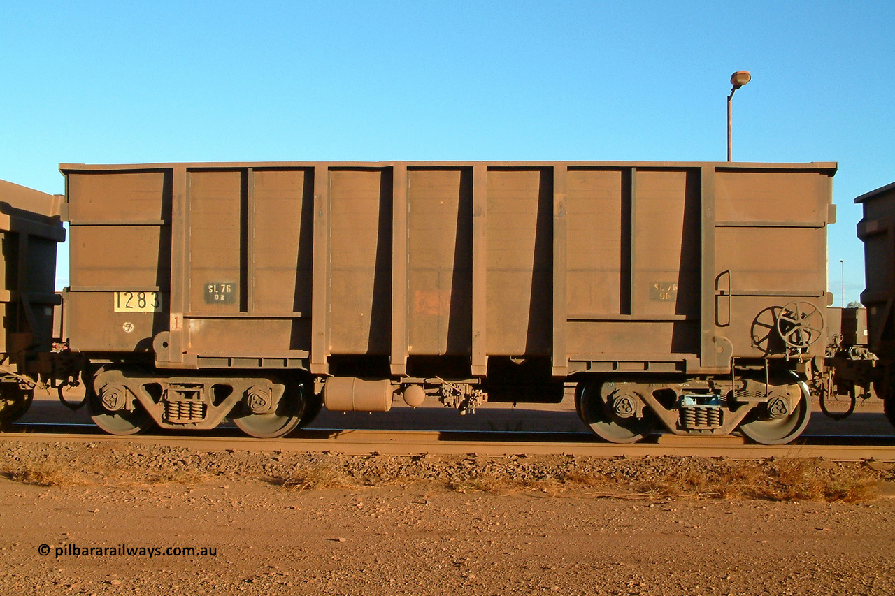 1283 Comeng 040815 165806
Nelson Point Car Dumper 2, a waggon originally built by Comeng WA in 1973-74 and numbered 1283. But note the rounded bottom edge, this shows that it is a rebuilt ore waggon with 3CR12 stainless steel sides, while the ends, transoms and side ribs are the originals. These waggons were originally of a plain steel construction and were painted inside to prevent rust and wear. August 15, 2004.
Keywords: 1283;Comeng-WA;BHP-ore-waggon;