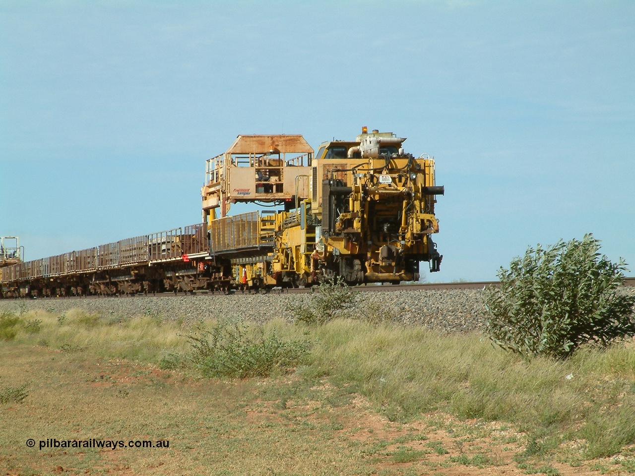040502 085622
Mooka Siding, trailing view of the 'Pony' heading south, with the Harsco Pony track re-laying machine on the rear.
Keywords: Harsco;BHP-pony-waggon;Pony-Track-Relayer;