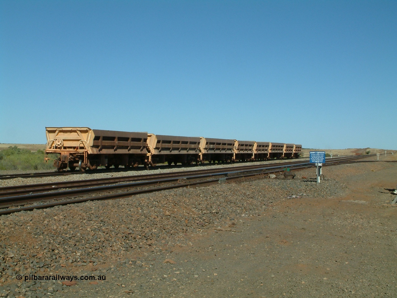 040810 145555
Shaw Siding backtrack, view looking south with Quarry 8 track leading off to the right, a line up of Difco Ohio USA built side dump waggons, a combination of both Mt Newman long and short versions and Goldsworthy Mining short version no. 4 closest to camera.
Keywords: Difco-Ohio-USA;GML;BHP-ballast-waggon;