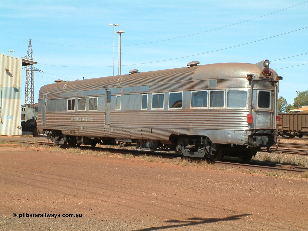 040912 142134
Nelson Point, Silver Star observation coach, 'Sundowner', 3/4 view from rear end. Originally built by E. G. Budd in 1939 numbered 301 as the Silver Star as a diner-parlour-observation coach on the Chicago, Burlington and Quincy Railroad's General Pershing Zephyr train from the 1930s and 1940s. Donated to Mt Newman Mining Co. by AMAX an original joint venture partner to commemorate the projects first 100 million tonnes of iron ore railed between Mount Whaleback mine and the Port Hedland port.
Keywords: Silver-Star;EG-Budd;Sundowner;General-Pershing-Zephyr;301;
