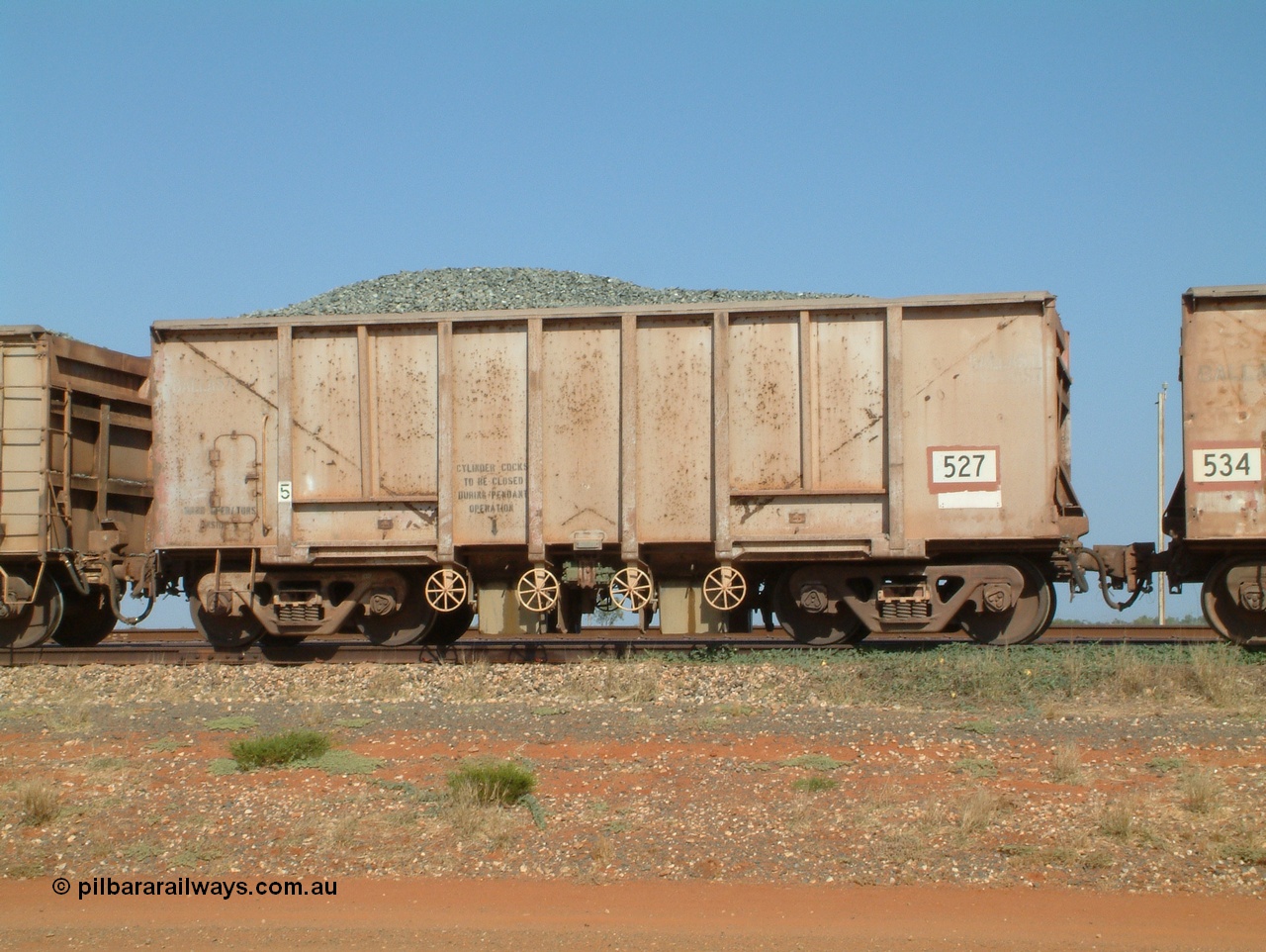 041012 082953
Bing Siding, one of one hundred and forty four original Oroville Dam 91 ton ore waggons built by Magor USA in 1963, sold to Mt Newman Mining in 1968, 527, seen here converted to a ballast car. Note the weld line where the internal plates are for bottom discharge of ballast.

