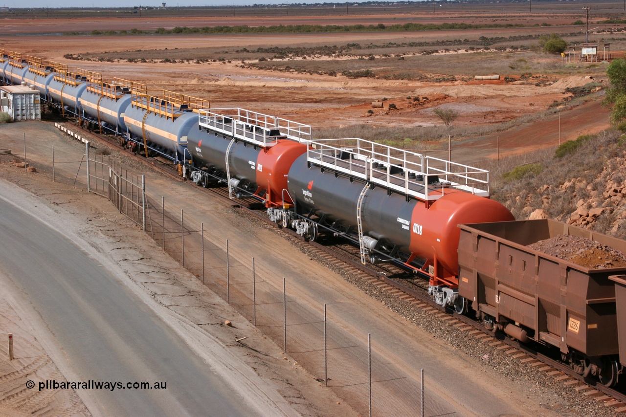 050315 0233
Redbank Bridge, elevated view of empty 116 kL fuel tanks all built by Comeng in both NSW and WA, on the rear of a loaded ore train arriving into Nelson Point yard, waggons include 0018, 0015, 0017, 0012, 0016, 0014, 0013, 0011 and 0010.
Keywords: Comeng-WA;Comeng-NSW;BHP-tank-waggon;
