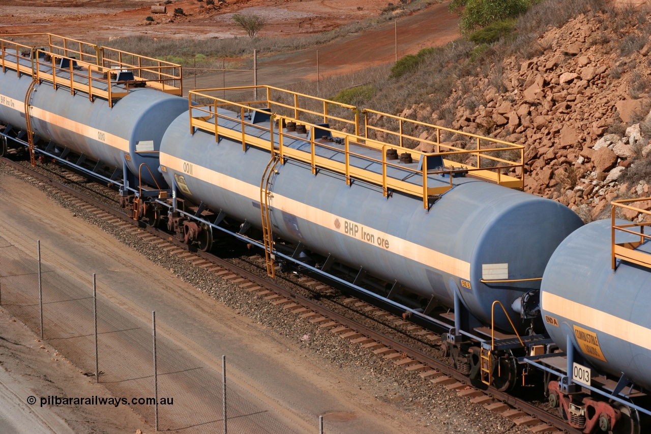 050315 0241
Redbank Bridge, elevated view of empty 116 kL fuel tanks all built by Comeng in both NSW and WA, 0011 and others in the BHP blue and white livery.
Keywords: Comeng-WA;BHP-tank-waggon;