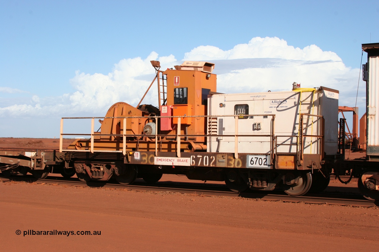 050319 0139
Nelson Point, a heavily cut down and modified Magor USA ore waggon, converted to a 50 tonne waggon and designated the winch waggon with generator set to power the winch and the crib car.
Keywords: Magor-USA;Mt-Newman-Mining-WS;BHP-rail-train;