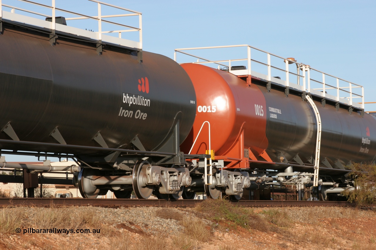 050410 0542
Nelson Point, tanker filling area, fuel tank waggon 0015, a Comeng NSW built 112 kilolitre tank waggon, one of a batch of four built in 1972 wearing the newer corporate 'Earth' livery of BHP Billiton Iron Ore.
Keywords: Comeng-WA;BHP-tank-waggon;
