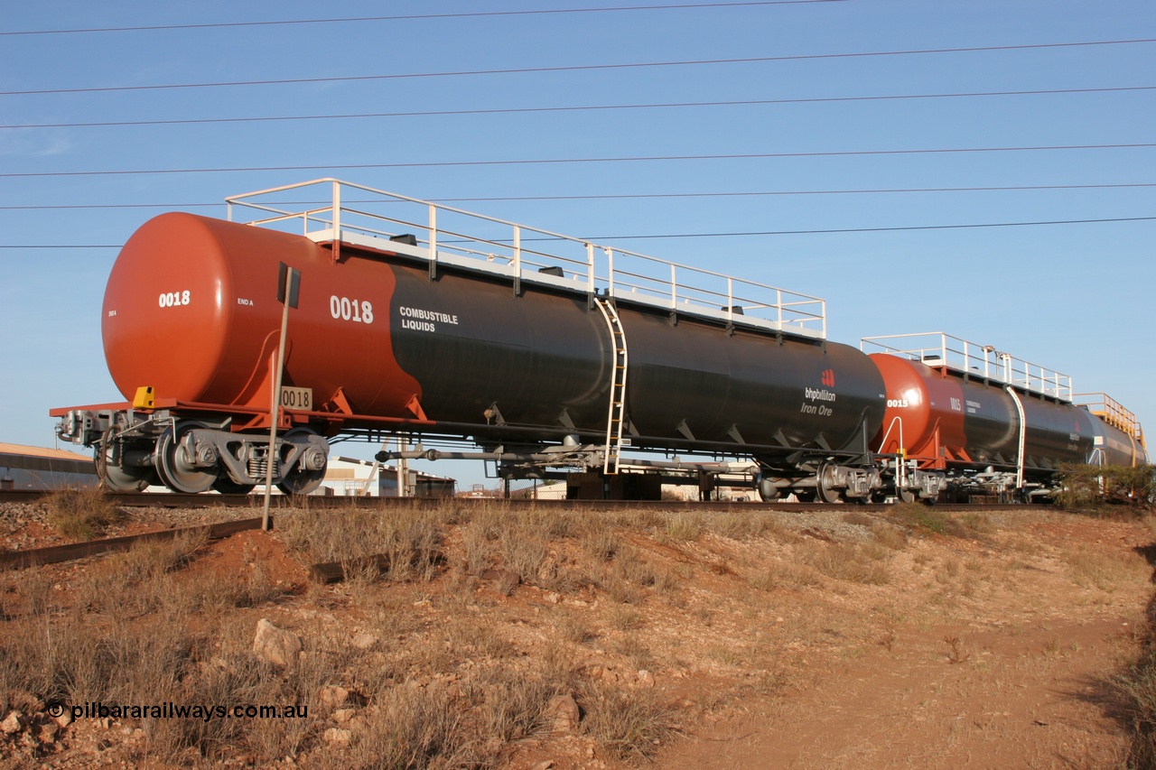 050410 0545
Nelson Point, tanker filling area, fuel tank waggons 0018 a Comeng WA built 114 kilolitre tank waggon, one of a batch of three built in 1974-75 and 0015 a Comeng NSW built 112 kilolitre tank waggon, one of a batch of four built in 1972 and both wearing the newer corporate 'Earth' livery of BHP Billiton Iron Ore.
Keywords: Comeng-WA;BHP-tank-waggon;