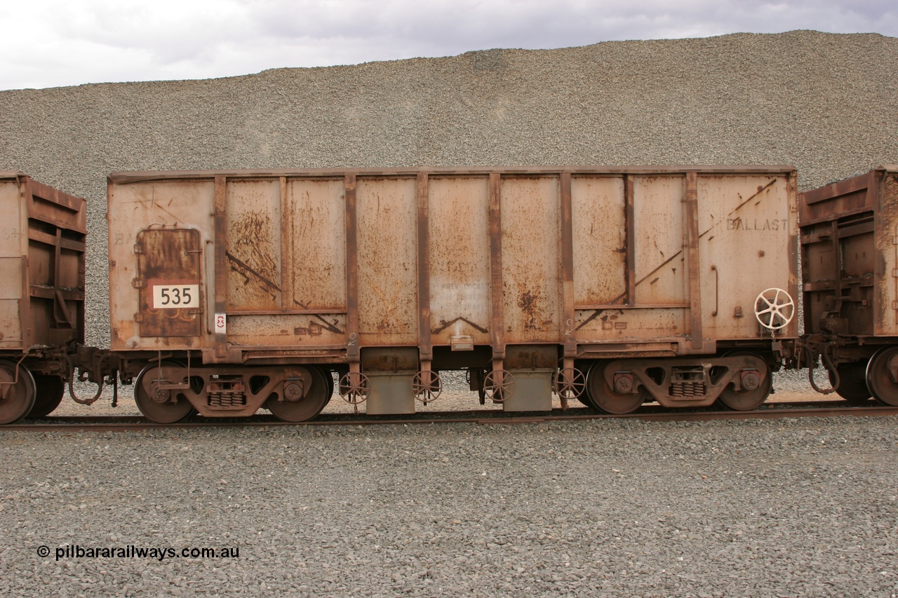 050412 0770
Quarry 8, Shaw Siding area. Side view of 1963 built Magor USA waggon 535, originally in ore service before conversion to a ballast waggon.
Keywords: Magor-USA;BHP-ballast-waggon;