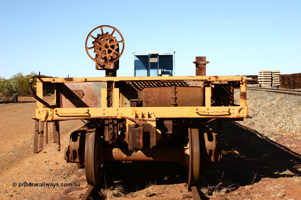 050518 2121
Flash Butt yard, heavily stripped down riveted waggon 206, possible original ballast waggon, number 206 was originally a waggon in the 'Camp Train' and appears to have USA origin, view of handbrake end.
Keywords: BHP-flat-waggon;