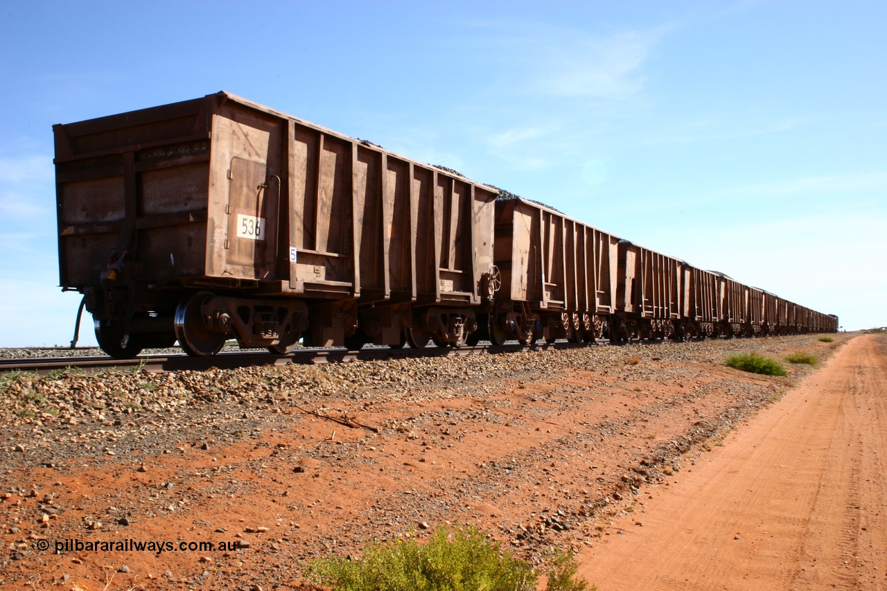 050518 2200
Bing Siding. Rear 3/4 view of ballast train and of 1963 built Magor USA waggon 536, originally in ore service before conversion to a ballast waggon.
Keywords: Magor-USA;BHP-ballast-waggon;