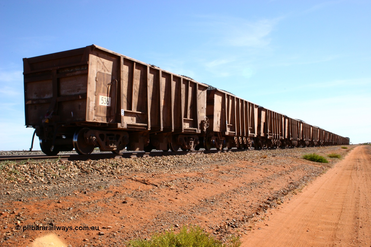 050518 2201
Bing Siding. Rear 3/4 view of ballast train and of 1963 built Magor USA waggon 536, originally in ore service before conversion to a ballast waggon.
Keywords: Magor-USA;BHP-ballast-waggon;