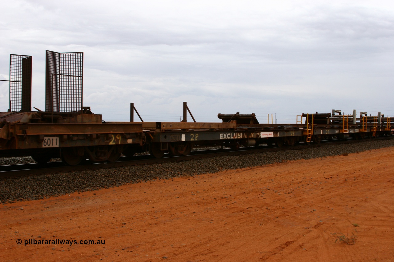 050522 2738
Goldsworthy Junction, rail recovery and transport train flat waggon #28, second lead in waggon 6201, built by Comeng WA in January 1977 under order number 07-M-282 RY, the mesh guarding is for the winch cable. The chute arrangement for the discharging and recovery of rail is visible.
Keywords: Comeng-WA;BHP-rail-train;