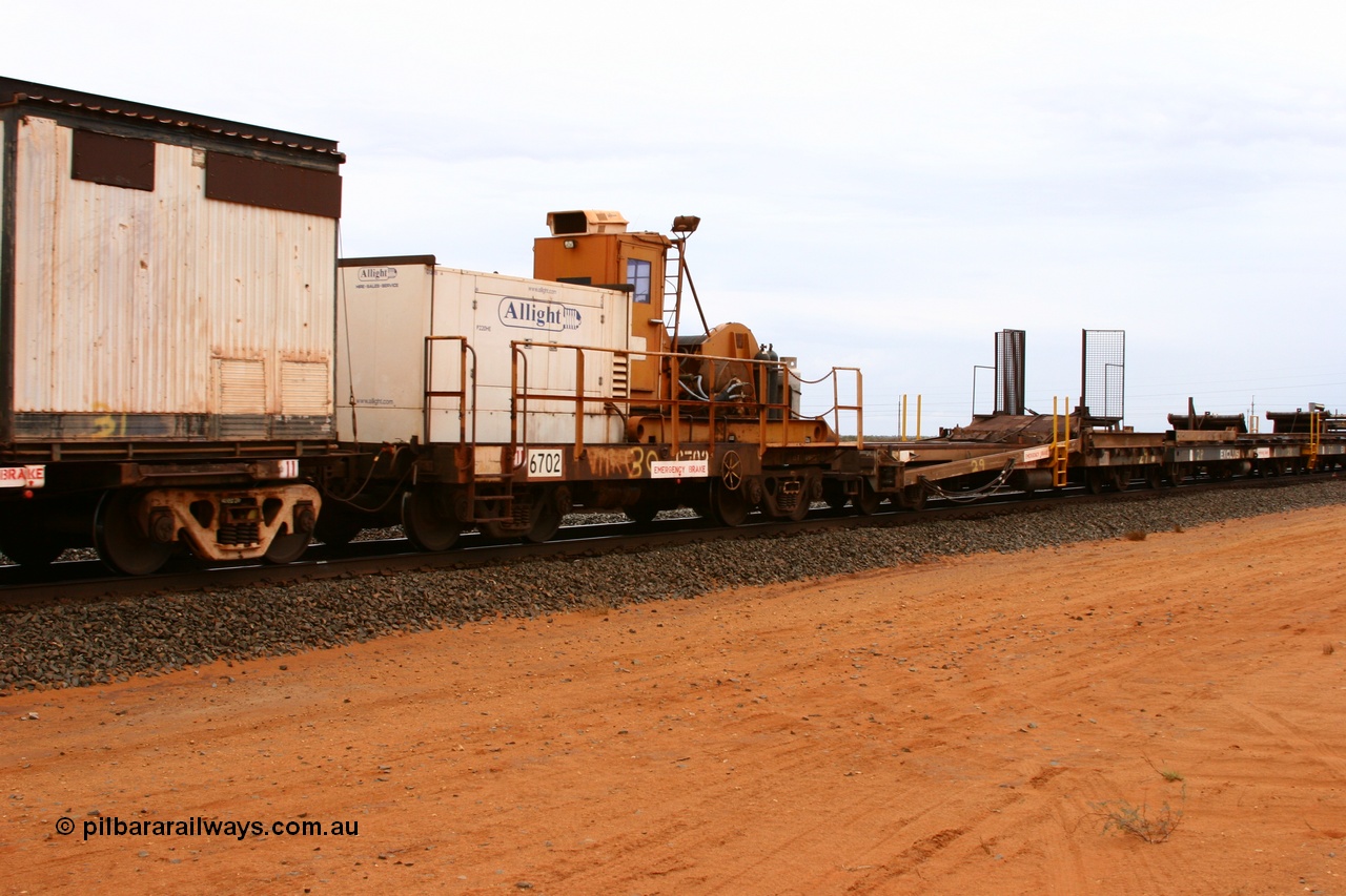 050522 2740
Goldsworthy Junction, rail recovery and transport train, flat waggon 6702, heavily cut down and modified Magor USA ore waggon by Mt Newman Mining workshops, converted to a 50 tonne waggon and designated the winch waggon with generator set to power the winch and the crib car.
Keywords: Magor-USA;Mt-Newman-Mining-WS;BHP-rail-train;