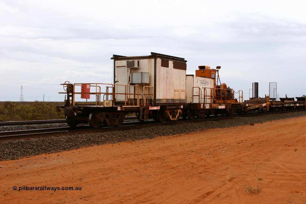050522 2741
Goldsworthy Junction, rail recovery and transport train, flat waggon 665, a cut down Magor USA built former Oroville Dam 91 ton ore waggon, used as the crib waggon on the steel train.
Keywords: Magor-USA;BHP-rail-train;