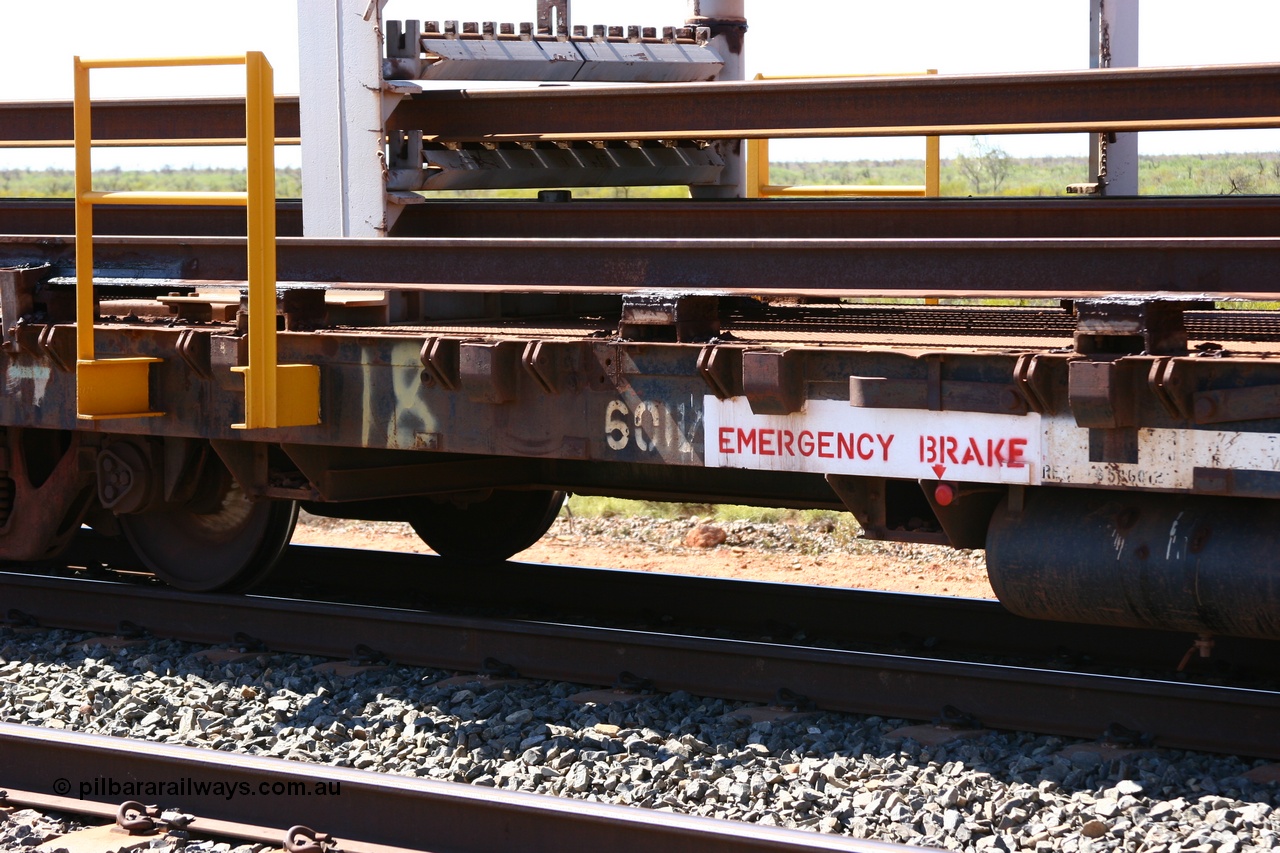 050525 2952
Mooka Siding, rail recovery and transport train flat waggon #18, 6012, built by Scotts of Ipswich Qld in September 1970, view of number board and rail support structure.
Keywords: Scotts-Qld;BHP-rail-train;