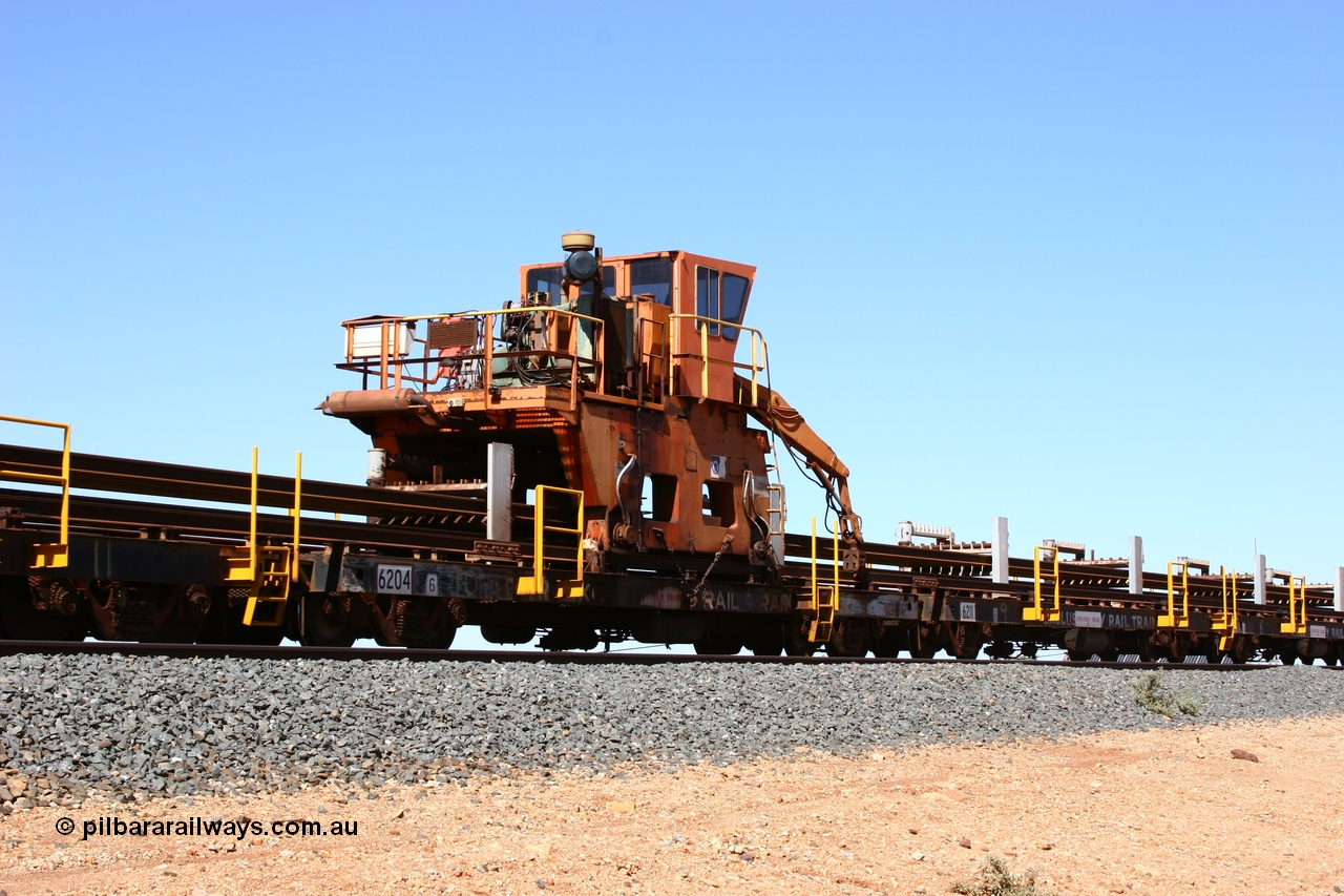 050525 2985
Mooka Siding, rail recovery and transport train flat waggon #10, 6204, built by Comeng WA in February 1977 under order number 07-M-282 RY, with the Gemco built straddle crane.
Keywords: Comeng-WA;BHP-rail-train;