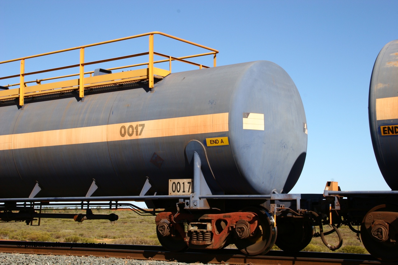 050704 3975
Bing Siding, empty 116 kL Comeng WA built tank waggon 0017 from 1974-5, one of six such tank waggons, detail of A end and bogie.
Keywords: Comeng-WA;BHP-tank-waggon;