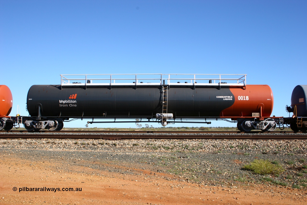 050704 3983
Bing Siding, empty 116 kL Comeng WA built tank waggon 0018 from 1974-5, one of six such tank waggons, wearing the BHP Billiton Earth livery, side view.
Keywords: Comeng-WA;BHP-tank-waggon;
