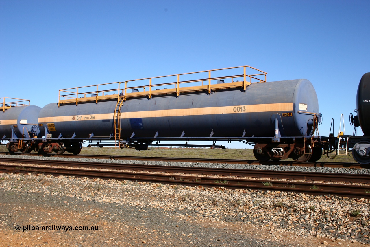 050704 3986
Bing Siding, empty 116 kL Comeng WA built tank waggon 0013 from 1974-5, one of six such tank waggons.
Keywords: Comeng-WA;BHP-tank-waggon;