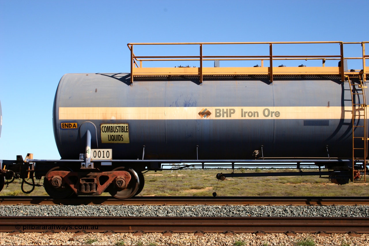 050704 3991
Bing Siding, empty 116 kL Comeng NSW built tank waggon 0010 from 1972, one of three such tank waggons, detail view of A end and bogie.
Keywords: Comeng-NSW;BHP-tank-waggon;