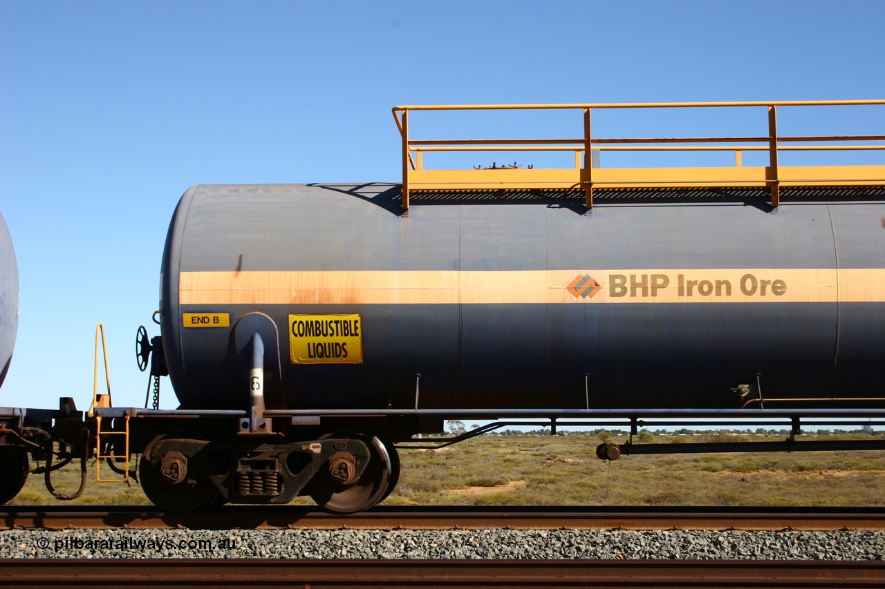050704 3994
Bing Siding, empty 116 kL Comeng WA built tank waggon 0016 from 1974-5, one of six such tank waggons, detail of A end and bogie.
Keywords: Comeng-WA;BHP-tank-waggon;