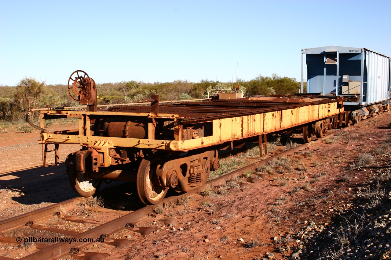 050713 4102
Flash Butt yard, heavily stripped down riveted waggon 206, possible original ballast waggon, number 206 was originally a waggon in the 'Camp Train' and appears to have USA origin, 3/4 view from handbrake end.
Keywords: BHP-flat-waggon;