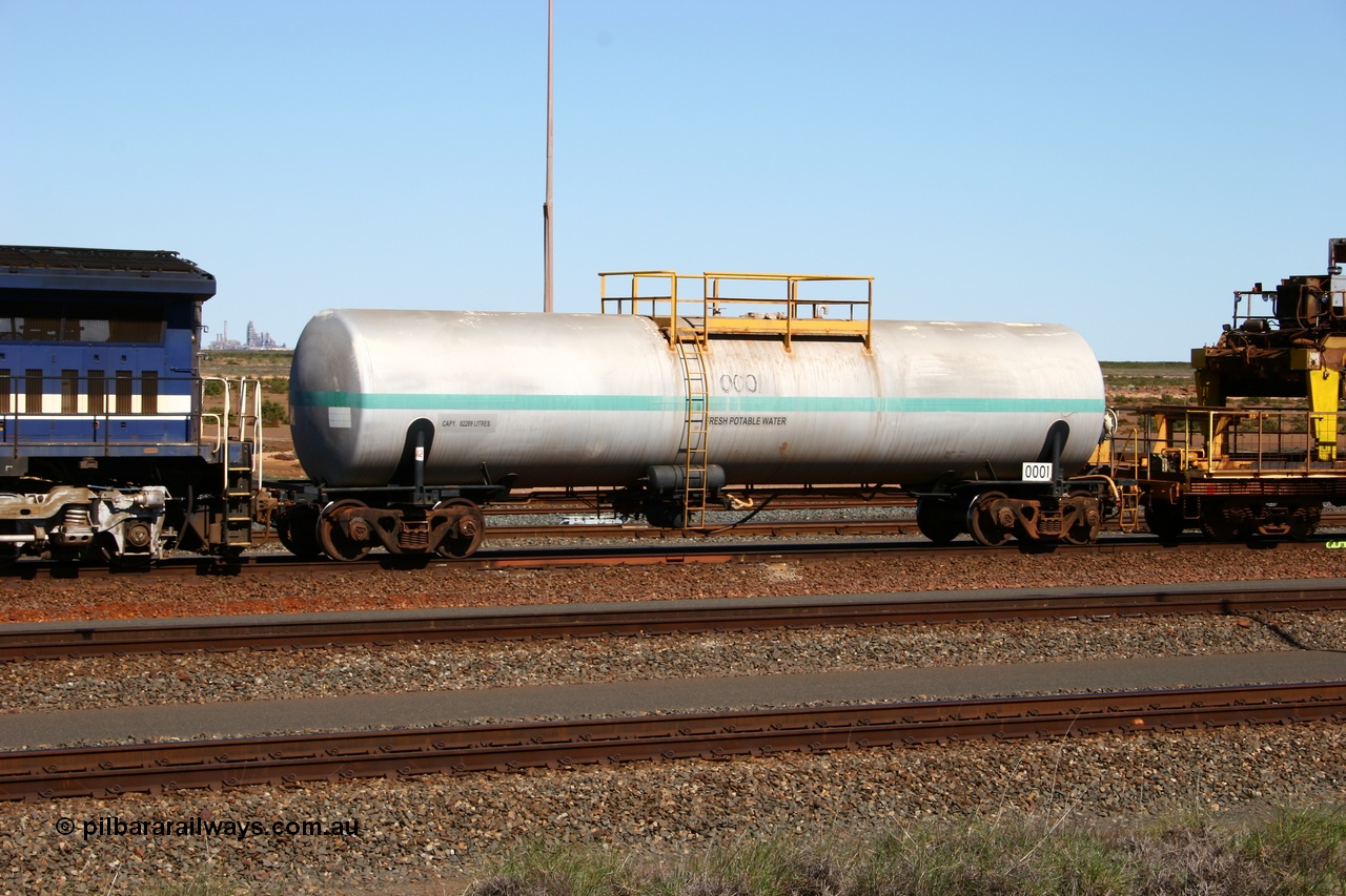 050724 4209
Nelson Point yard, Comeng NSW built 82 kilolitre water tank waggon 0001, one of two such tank waggons built in November 1970, attached to the Pony as they relay a road in the yard.
Keywords: Comeng-NSW;BHP-tank-waggon;