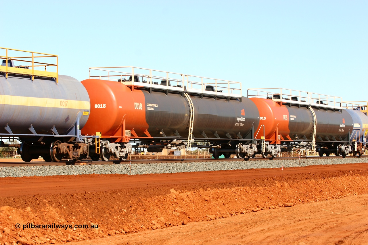 050724 4307
Bing Siding, empty fuel tank waggon 0018, a Comeng WA built 116 kilolitre tank waggon, one of a batch of six built in 1974-75 wearing the newer corporate 'Earth' livery of BHP Billiton Iron Ore.
Keywords: Comeng-WA;BHP-tank-waggon;
