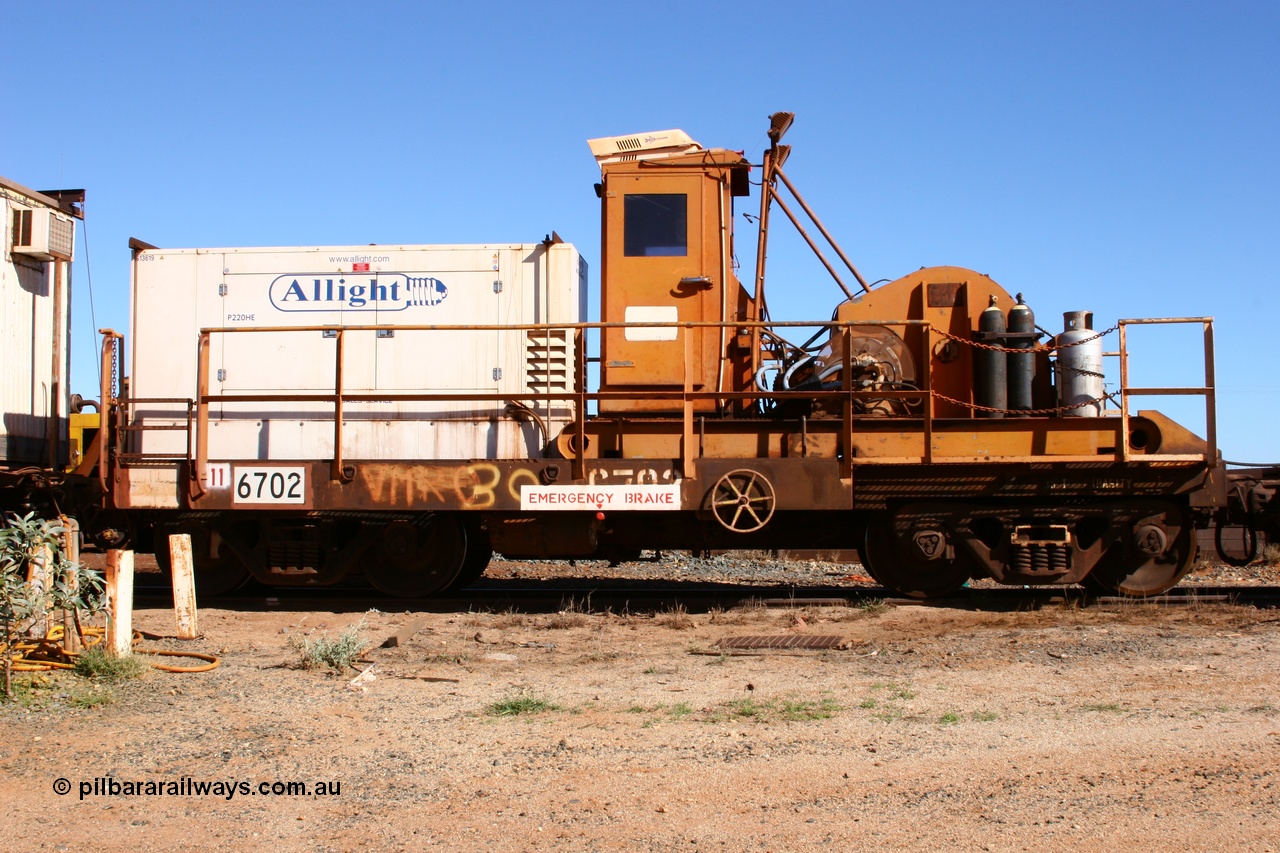 050801 4763
Flash Butt yard, rail recovery and transport train, flat waggon 6702, heavily cut down and modified Magor USA ore waggon by Mt Newman Mining workshops, converted to a 50 tonne waggon and designated the winch waggon with generator set to power the winch and the crib car.
Keywords: Magor-USA;Mt-Newman-Mining-WS;BHP-rail-train;