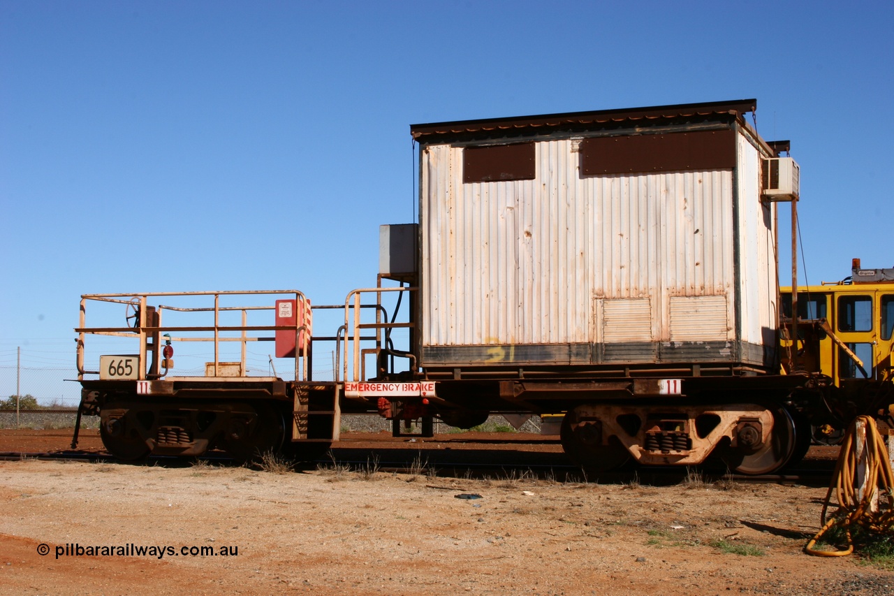 050801 4764
Flash Butt yard, rail recovery and transport train, cut down by Mt Newman Mining workshops, a Magor USA built former Oroville Dam 91 ton ore waggon 665, seen here being used as the crib waggon on the end of the steel train.
Keywords: Magor-USA;BHP-rail-train;