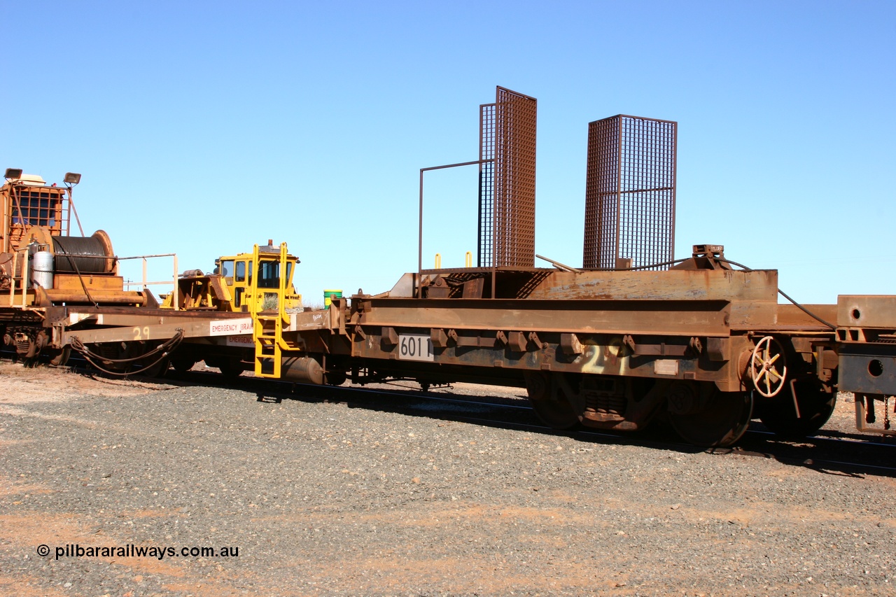050801 4766
Flash Butt yard, rail recovery and transport train, 1st lead off waggon 6011, built by Scotts of Ipswich Qld on 04-09-1970, the mesh guarding is for the winch cable. The chute arrangement for the discharging and recovery of rail is visible.
Keywords: Scotts-Qld;BHP-rail-train;
