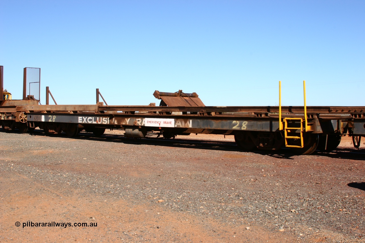 050801 4767
Flash Butt yard, rail recovery and transport train, #28 2nd lead off waggon 6201, built by Comeng WA January 1977 under order no. 07-M-282 RY, the mesh guarding is for the winch cable. The chute arrangement for the discharging and recovery of rail is visible.
Keywords: Comeng-WA;BHP-rail-train;