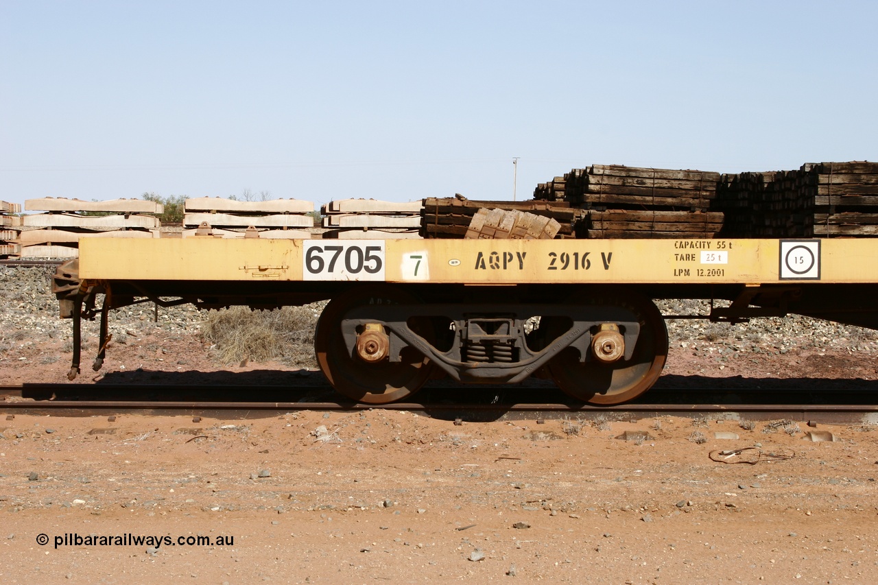 051001 5621
Flash Butt yard, BHP flat waggon 6705 with EDI decal and ROA code of AQPY 2916, 55 tonne capacity, unsure of original owner, possible AN AOOX, then cut down to the Pilbara through CFCLA.
Keywords: 6705;AQPY-type;AQPY2916;CFCLA;BHP-flat-waggon;