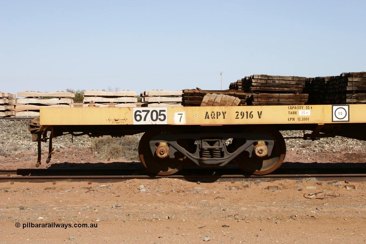 051001 5622
Flash Butt yard, BHP flat waggon 6705 with EDI decal and ROA code of AQPY 2916, 55 tonne capacity, unsure of original owner, possible AN AOOX, then cut down to the Pilbara through CFCLA.
Keywords: 6705;AQPY-type;AQPY2916;CFCLA;BHP-flat-waggon;