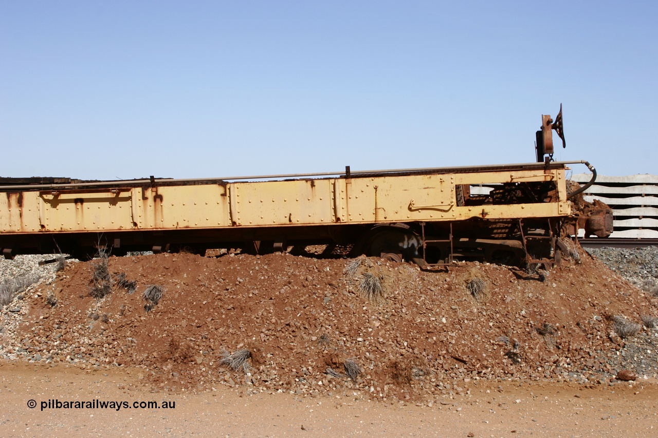 051001 5624
Flash Butt yard, heavily stripped down riveted waggon 206, possible original ballast waggon, number 206 was originally a waggon in the 'Camp Train' and appears to have USA origin, pushed into an earth bund with 55 tonne flat waggon 6705 behind, view from handbrake end.
Keywords: BHP-flat-waggon;