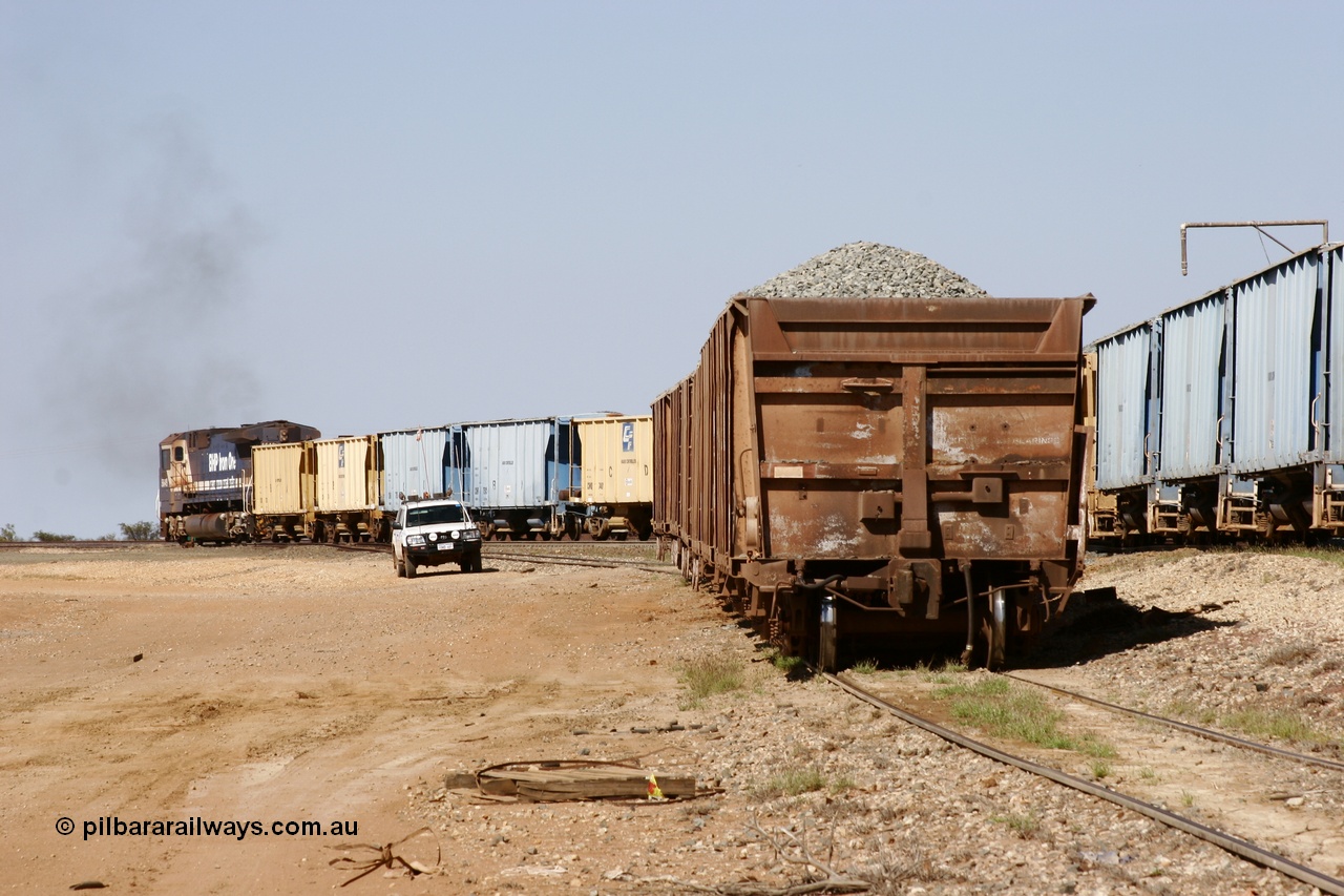 051001 5646
Flash Butt yard, rear of rake of Magor USA built ballast waggons, 534 is closest to camera and a Dash 8 shunts CFCLA ballast waggons.
Keywords: Magor-USA;BHP-ballast-waggon;