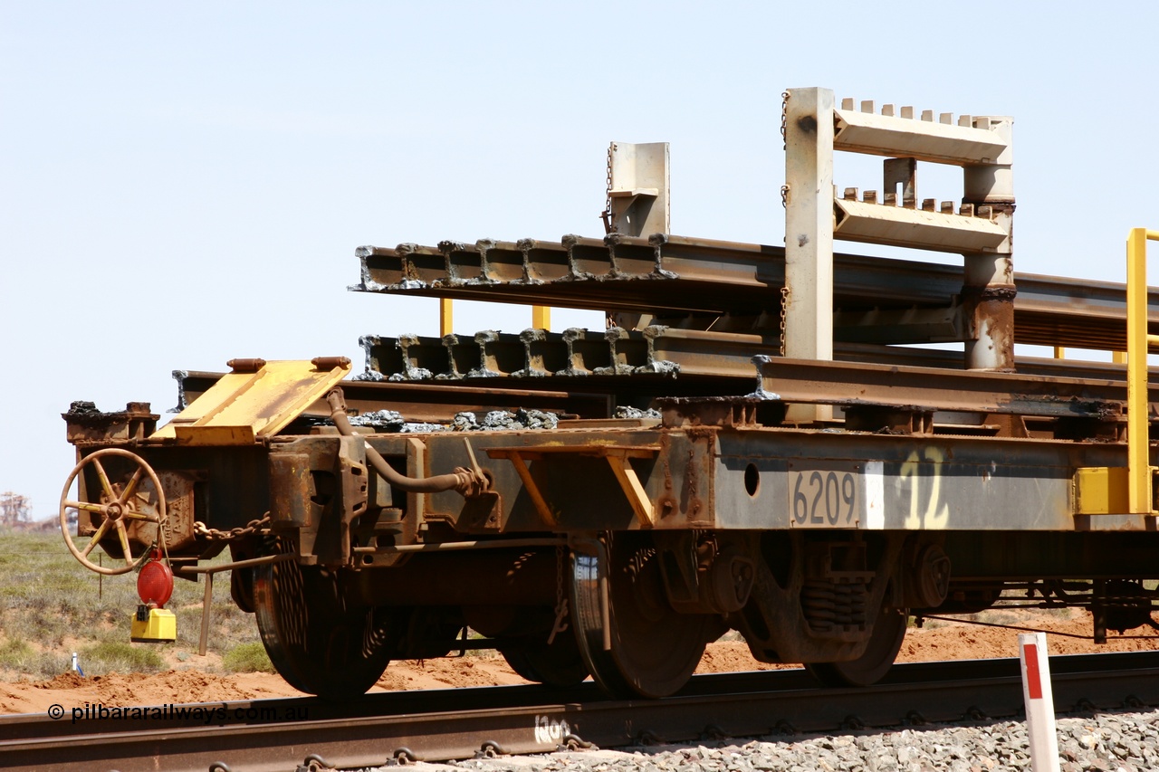 051001 5683
Boodarie, the Steel Train or rail recovery and transport train, hand brake end of waggon #12, 6209, a Comeng WA built flat waggon from January 1977 under order no. 07-M-282 RY.
Keywords: Comeng-WA;BHP-rail-train;