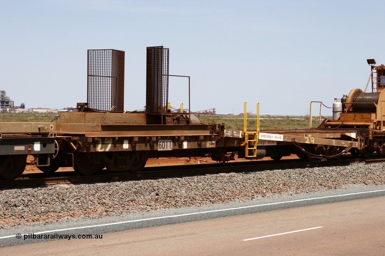 051001 5724
Boodarie, the Steel Train or rail recovery and transport train, 1st lead off waggon 6011, built by Scotts of Ipswich 04-09-1970, the mesh guarding is for the winch cable. The chute arrangement for the discharging and recovery of rail is visible.
Keywords: Scotts-Qld;BHP-rail-train;