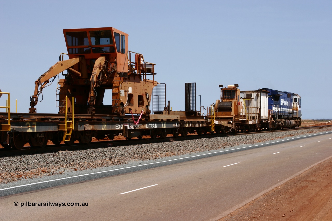 051001 5732
Boodarie, the Steel Train or rail recovery and transport train, flat waggon #28, 2nd lead off waggon 6201, built by Comeng WA in January 1977 under order no. 07-M-282 RY, with the Gemco built straddle crane.
Keywords: Comeng-WA;BHP-rail-train;