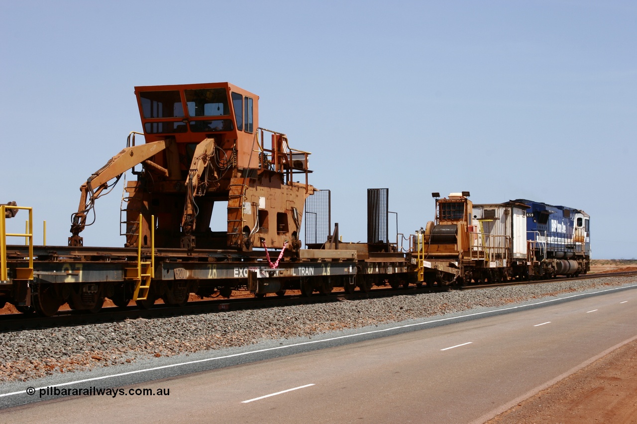 051001 5733
Boodarie, the Steel Train or rail recovery and transport train, flat waggon #28, 2nd lead off waggon 6201, built by Comeng WA in January 1977 under order no. 07-M-282 RY, with the Gemco built straddle crane.
Keywords: Comeng-WA;BHP-rail-train;