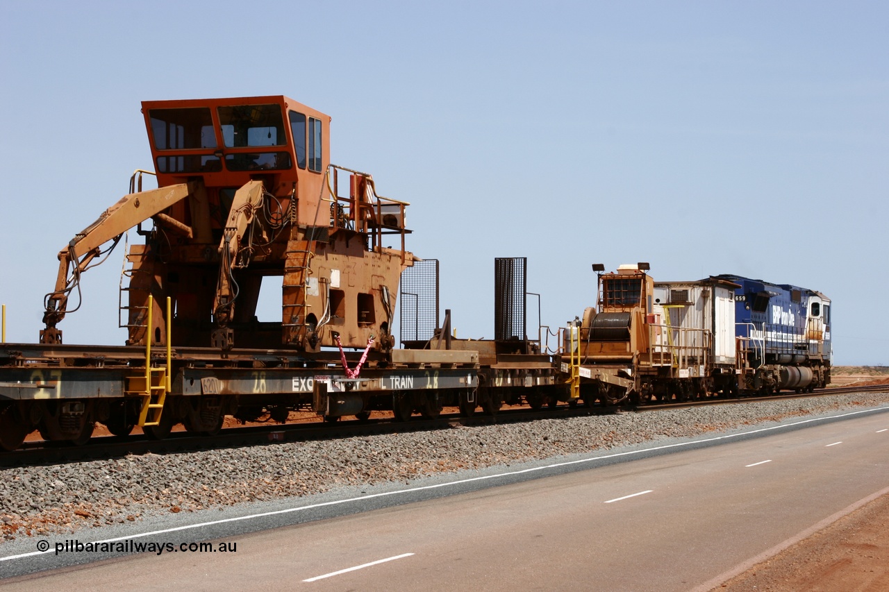 051001 5734
Boodarie, the Steel Train or rail recovery and transport train, flat waggon #28, 2nd lead off waggon 6201, built by Comeng WA in January 1977 under order no. 07-M-282 RY, with the Gemco built straddle crane.
Keywords: Comeng-WA;BHP-rail-train;