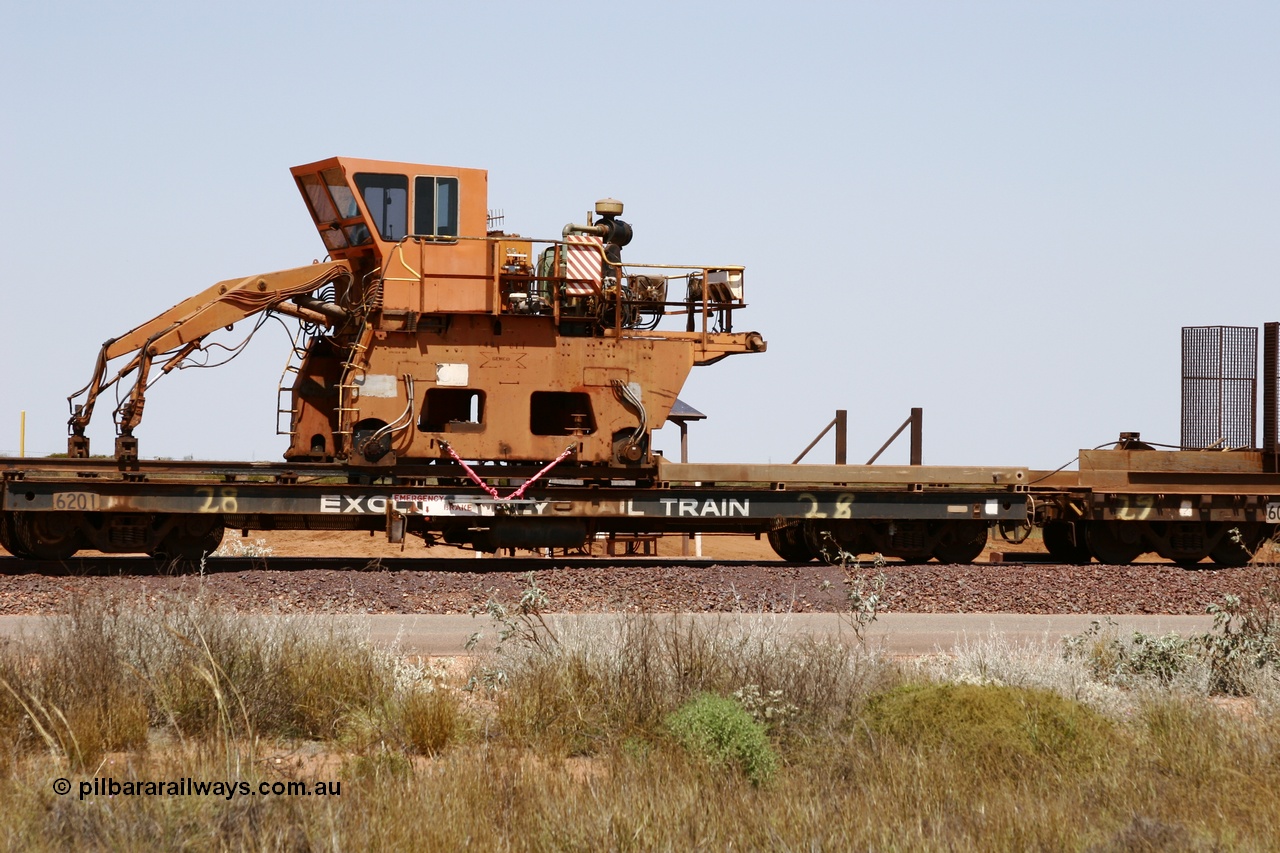 051001 5737
Boodarie, the Steel Train or rail recovery and transport train, flat waggon #28, 2nd lead off waggon 6201, built by Comeng WA in January 1977 under order no. 07-M-282 RY, with the Gemco built straddle crane.
Keywords: Comeng-WA;BHP-rail-train;